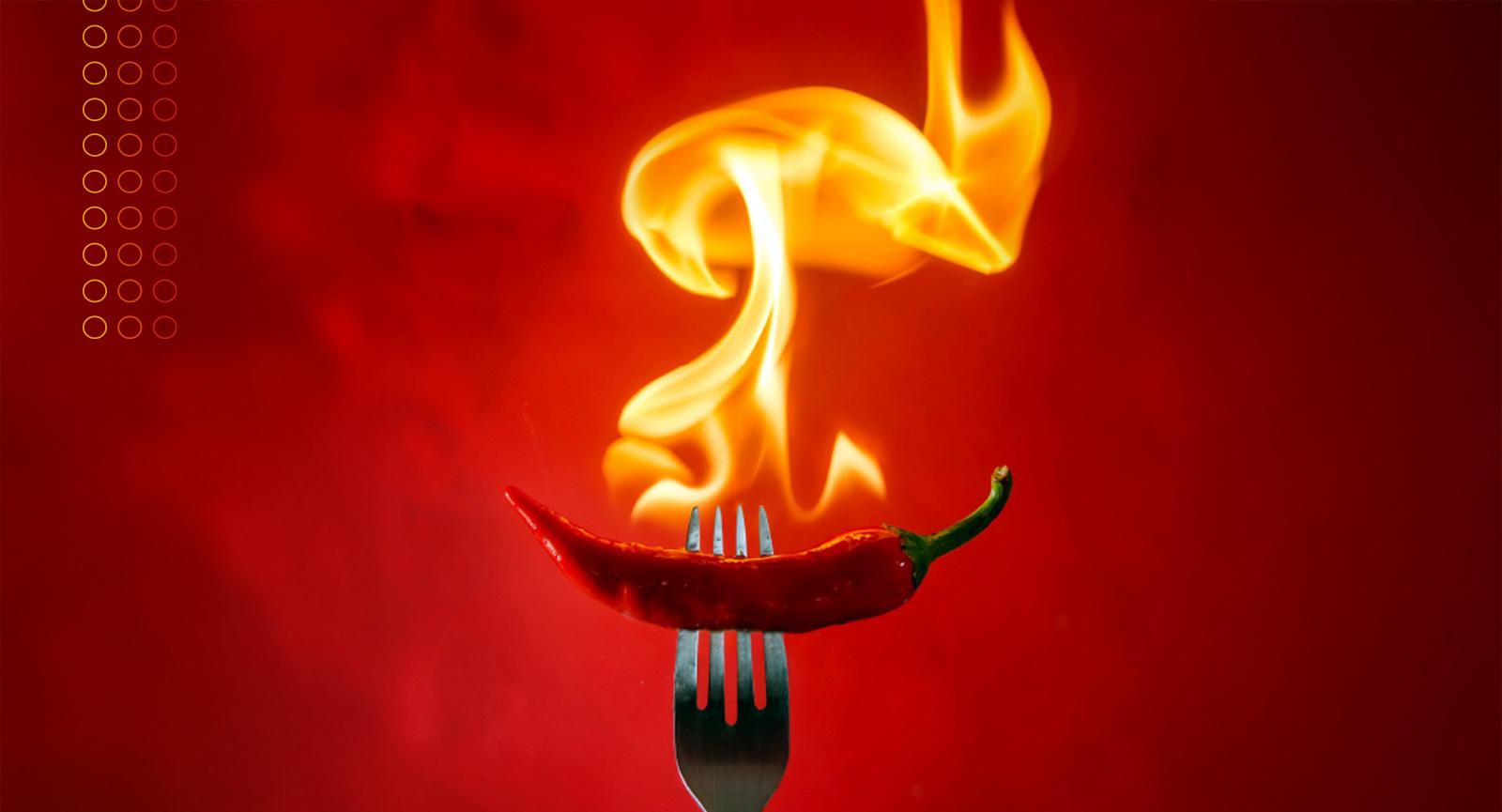 flaming chili pepper at the end of a fork